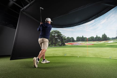 Carl's Curved golf simulator enclosure with immersive curved impact screen
