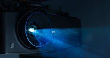 Projector in a golf simulator with ambient light