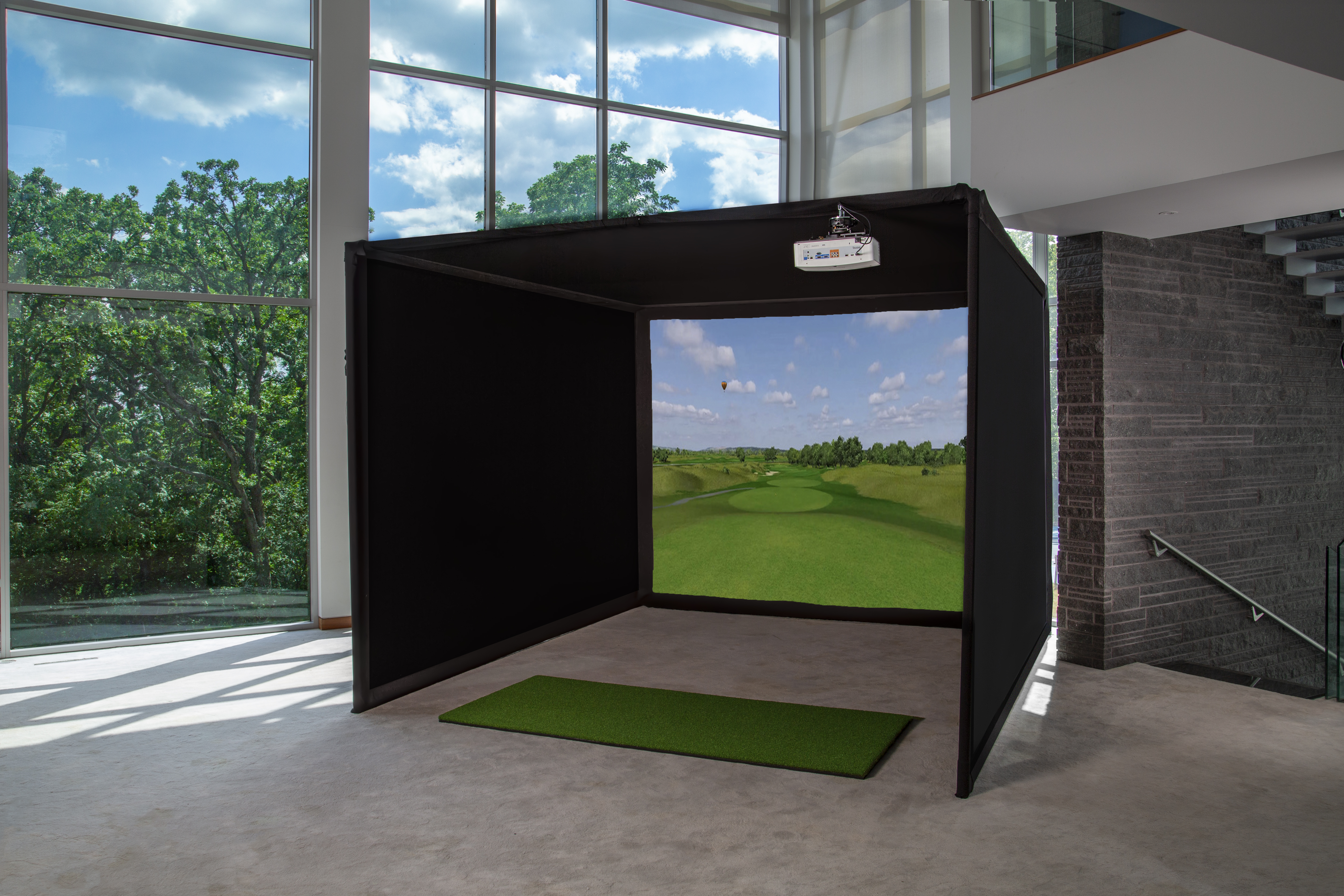 Golf simulator with hitting mat