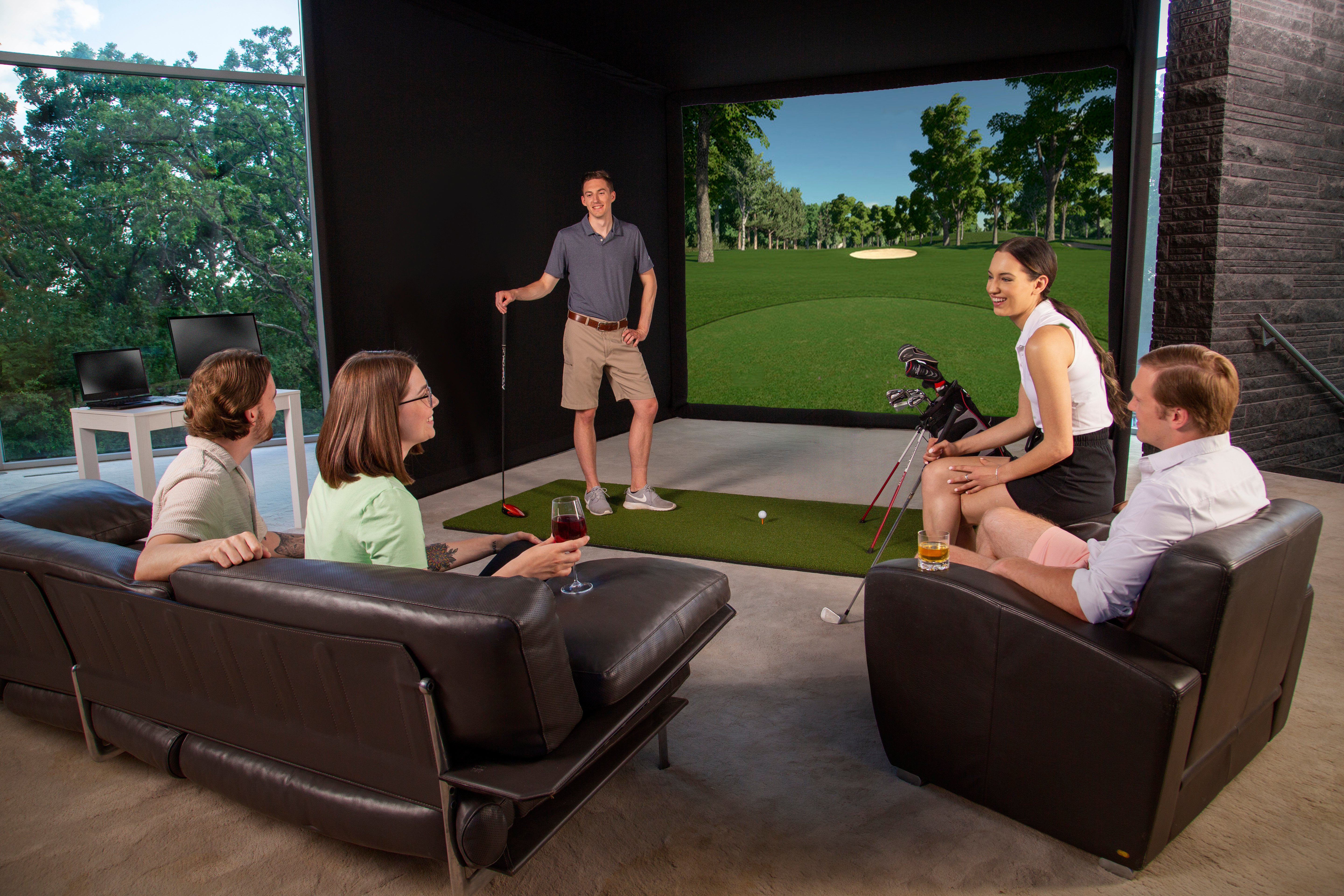 Friends enjoying a golf simulator