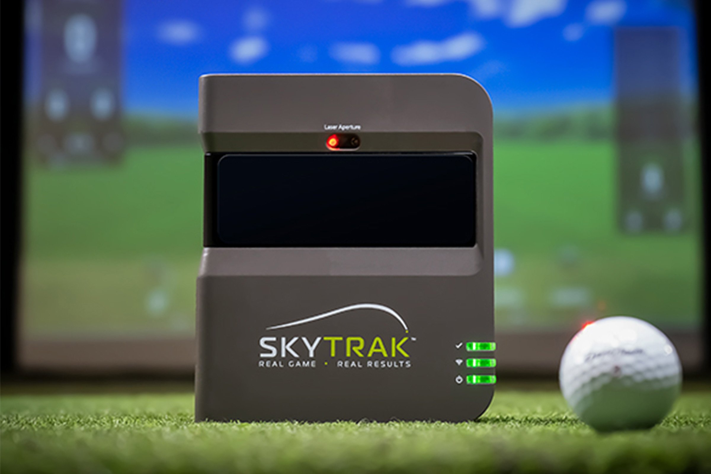 SkyTrak launch monitor in front of golf simulator