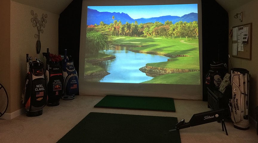 Golf simulator with golf bags, hitting mat indoor golf room
