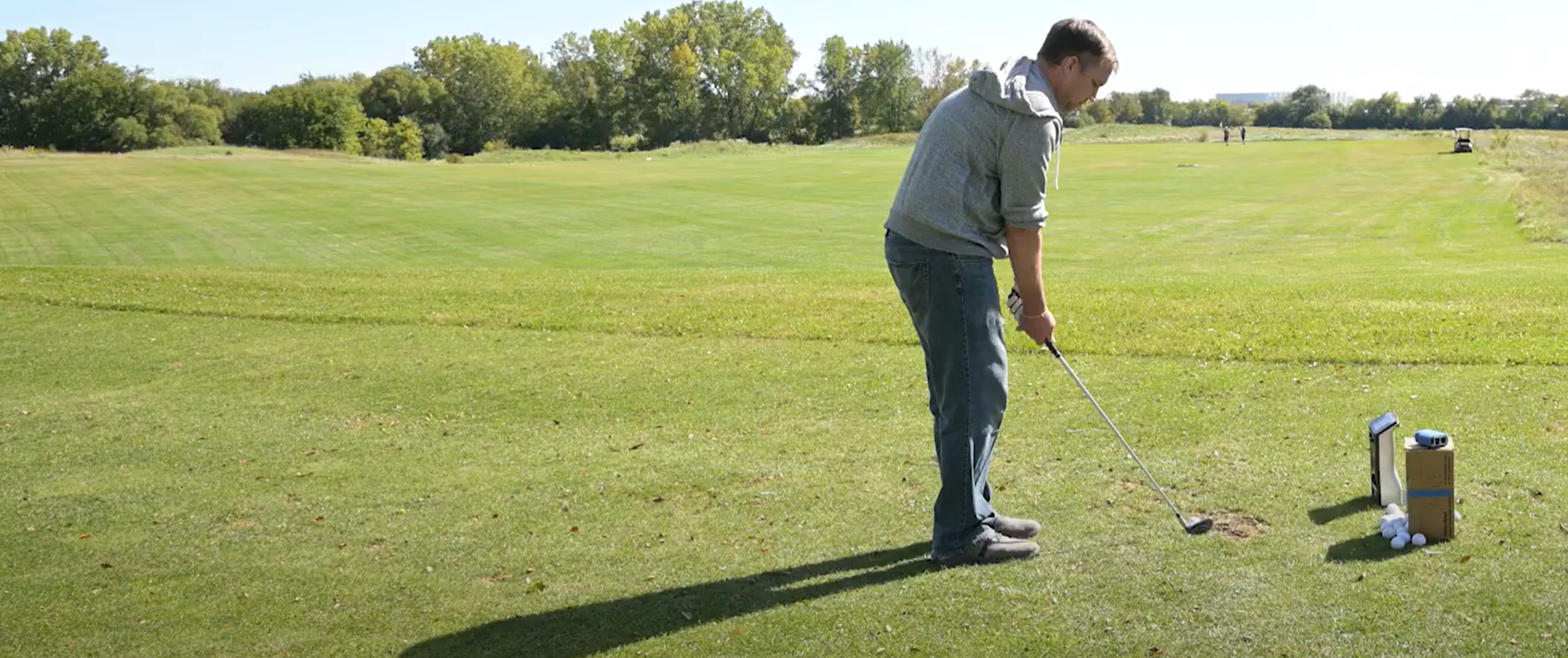 GCQuad on the driving range measuring a 6 iron